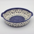 Round ceramic serving dish with handles – Bolesławiec pottery, hand-decorated with traditional patterns. Perfect for serving meats, salads, and appetizers. Stylish and durable Polish ceramic.
